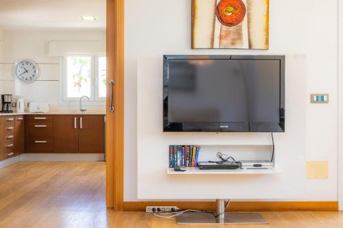 a flat screen tv on a wall in a living room at Villa Costa Eugenia in Cala d´Or