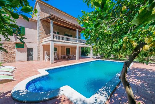 an image of a swimming pool in front of a house at Can Guixa in Sóller