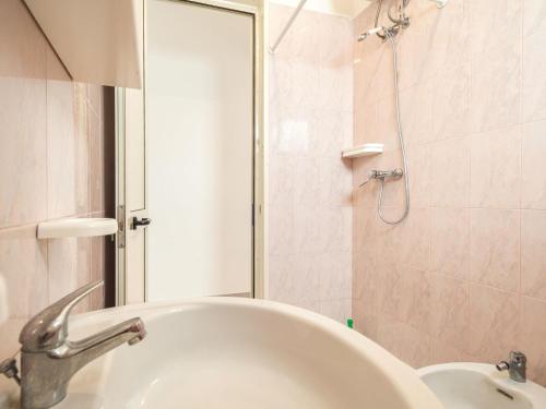 a bathroom with a sink and a shower at Villa Tetta sul mare in Torre Lapillo