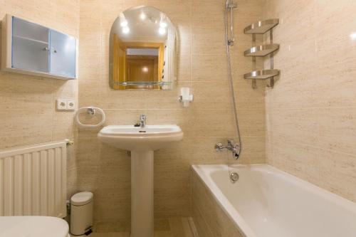 a bathroom with a sink and a toilet and a bath tub at Villa Jose in Palma de Mallorca