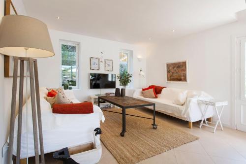 a living room with a couch and a table at Villa Jodie in Sóller