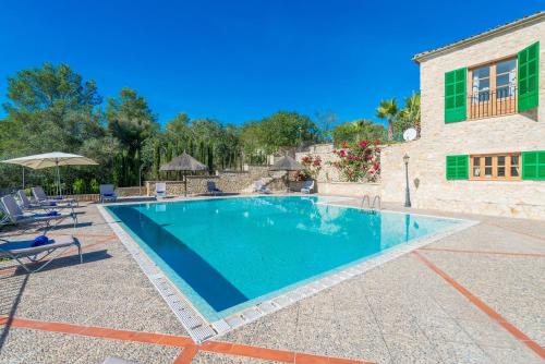 a swimming pool in front of a house at Son March in Petra