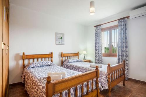 Postel nebo postele na pokoji v ubytování Villa Damian 12