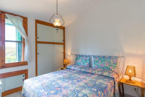 מיטה או מיטות בחדר ב-Appartamento La Marina trilocale