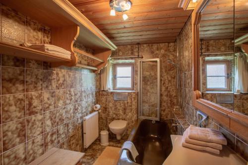 a bathroom with a sink and a toilet at Ferienwohnung Landhaus Staudacher in Tegernsee