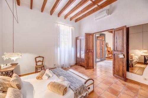 a bedroom with a large bed in a room at Finca Buniferri in Llucmajor