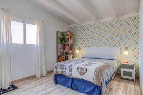 Posteľ alebo postele v izbe v ubytovaní Atico Casapueblo