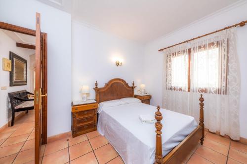 En eller flere senge i et værelse på Dofí