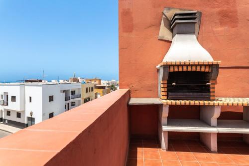 a bird house sitting on the side of a building at Casa Orymar in Cotillo