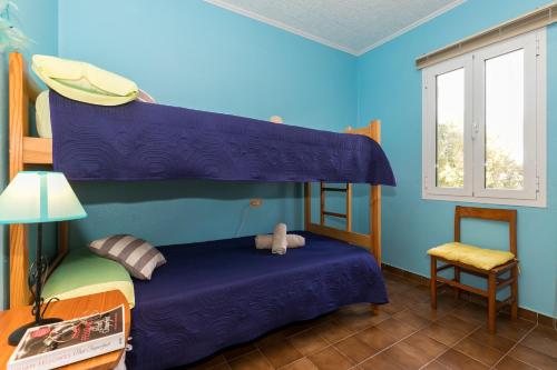 Llit o llits en una habitació de Apartamento cerca de Cala Mitjana