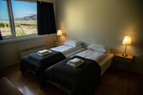 Cama o camas de una habitación en Hengifoss Guesthouse