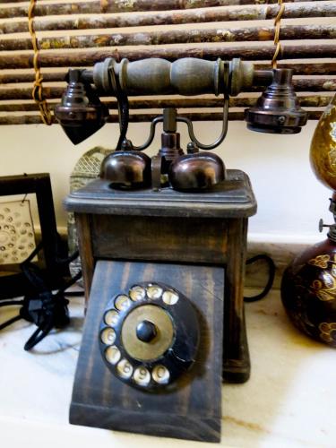 an old fashioned telephone is sitting on the floor at Casa Perpetua Hotel D Charm in Manaus