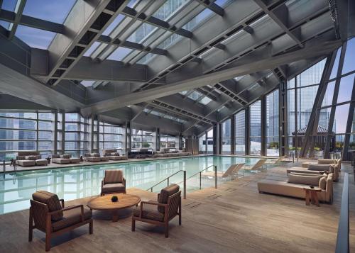 a rendering of a pool with chairs and a table at Park Hyatt Shenzhen in Shenzhen