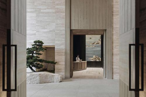a person sitting on a podium in a building at Park Hyatt Shenzhen in Shenzhen