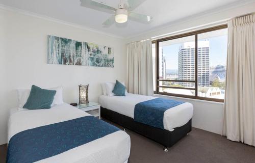 Cama o camas de una habitación en South Pacific Plaza - Official
