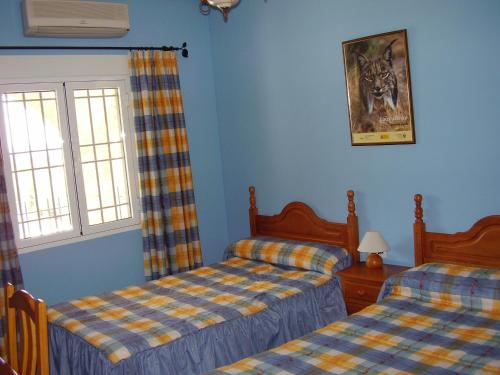 Postel nebo postele na pokoji v ubytování Casa Rural ¨La Noria Olaya¨