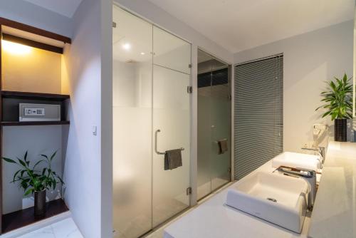 a bathroom with a sink and a shower at King Rock Residence in Siem Reap