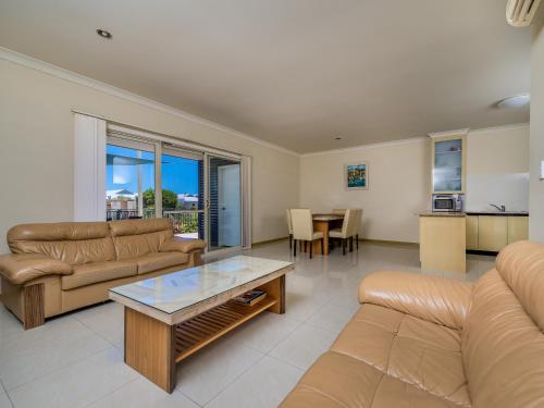 a living room with a couch and a table at Seafront Unit 49 in Jurien Bay