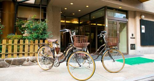 two bikes parked in front of a building at Nara Hakushikaso in Nara