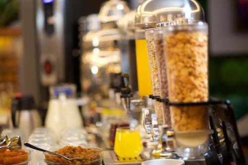 a table with some food and drinks on it at SORRISO HOTEL DUE in Istanbul