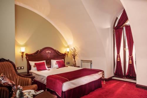 מיטה או מיטות בחדר ב-Staro Hotel