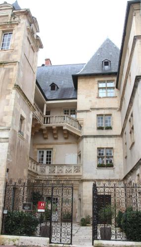 a building with a gate in front of it at Hotel D'haussonville in Nancy