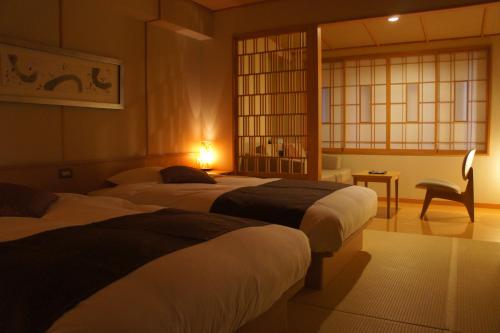 Una cama o camas en una habitación de Hotel Taisetsu Onsen&Canyon Resort