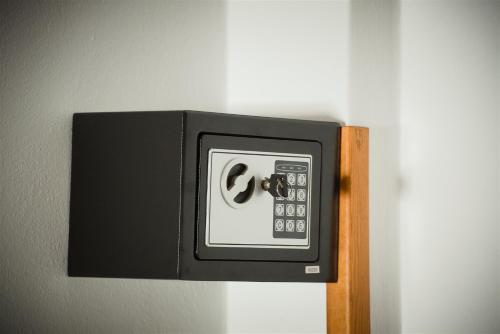 a wall mounted alarm clock on a wall at Galini Apartments in Lentas