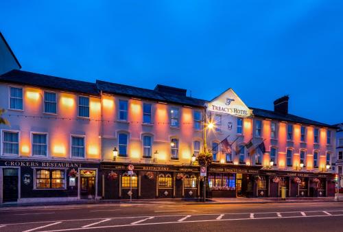 
a city street at night with a large building at Treacy’s Hotel Spa & Leisure Club Waterford in Waterford
