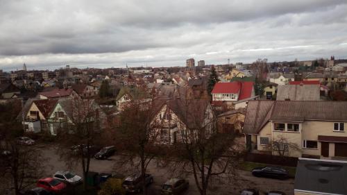 a view of a city with houses and cars at Bright apartment on top in Panevėžys