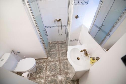 a bathroom with a toilet and a sink and a shower at Penzion hradu Svojanov in Svojanov
