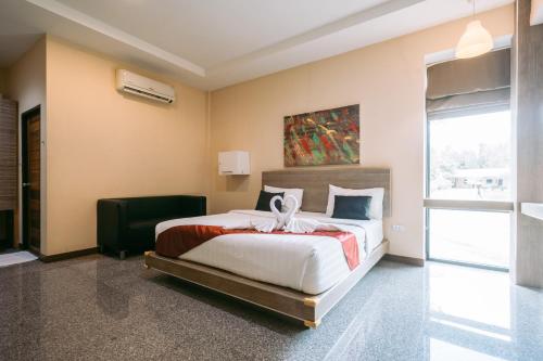 Postel nebo postele na pokoji v ubytování Jintana Resort