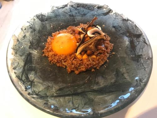 a plate of food with an egg on top at Hotel Villa Rosario, Palacete in Ribadesella