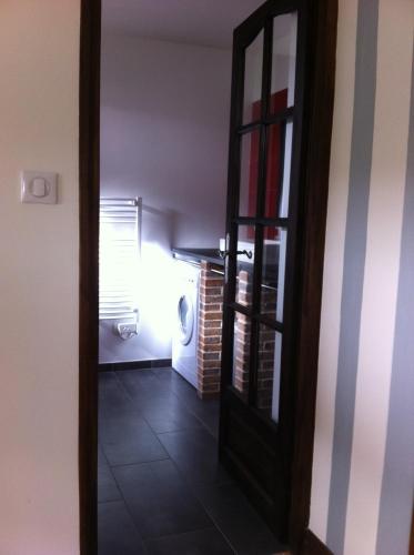 a hallway with a door leading to a room at Domaine du Chêne Crucy in Liré