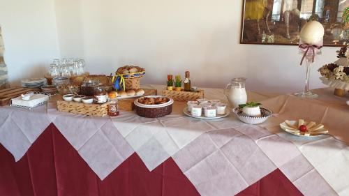 a table with food and bottles of wine on it at Agriturismo Duca di San Martino in Partanna