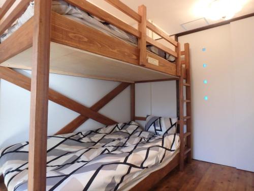 a bedroom with two bunk beds in a room at Kyo No Yado Nishioji inn in Kyoto