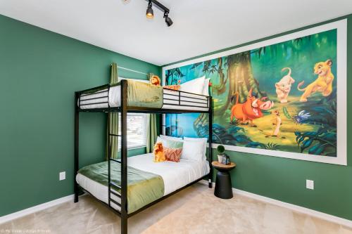 a bedroom with a bunk bed and a mural of dogs at Veranda Palms 8 Bedroom Home with Pool - 1722 in Kissimmee
