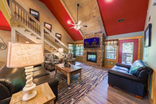 a living room with a couch and a table at Lap of Luxury chalet in Gatlinburg