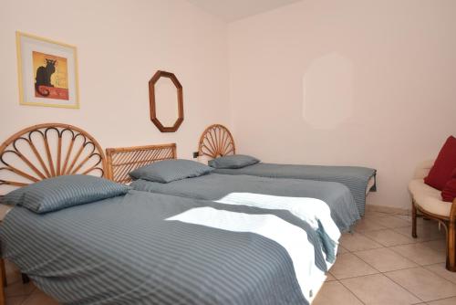 Postel nebo postele na pokoji v ubytování Appartamento Ciliegio