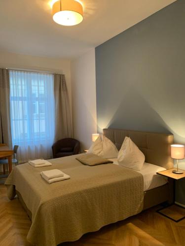 מיטה או מיטות בחדר ב-KH Apartments Stephansplatz