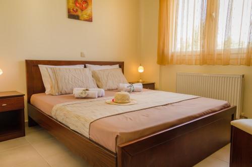 Postel nebo postele na pokoji v ubytování Olivera Apartments