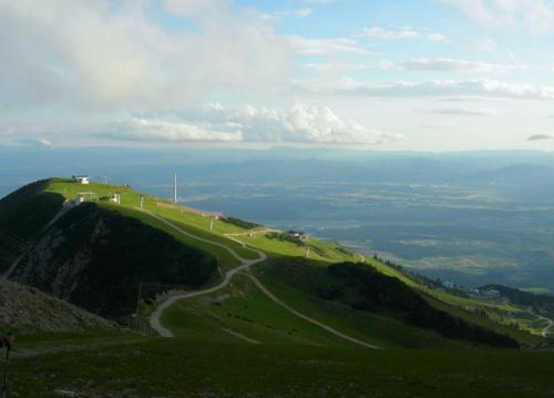 a winding road on top of a green hill at Jagodic Garni Hotel in Cerklje na Gorenjskem