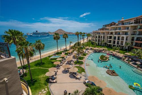 a view of a resort with a pool and a beach at Villa La Estancia - Medano Beach Villas in Cabo San Lucas