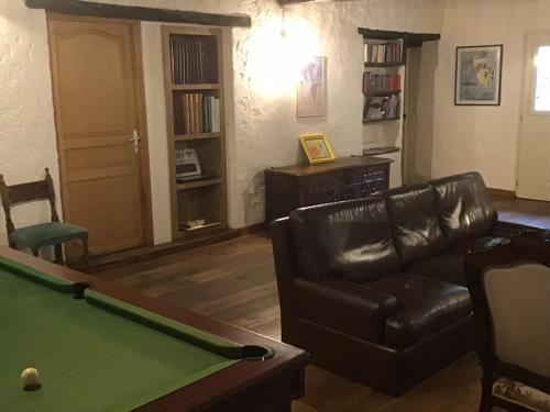 a living room with a pool table and a couch at Mas Graffouil in Prats-de-Mollo-la-Preste