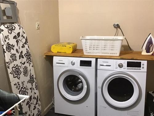 a laundry room with a washing machine and a counter at Mas Graffouil in Prats-de-Mollo-la-Preste