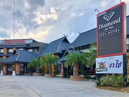 a hotel with a sign in front of it at Diamond de pai in Pai