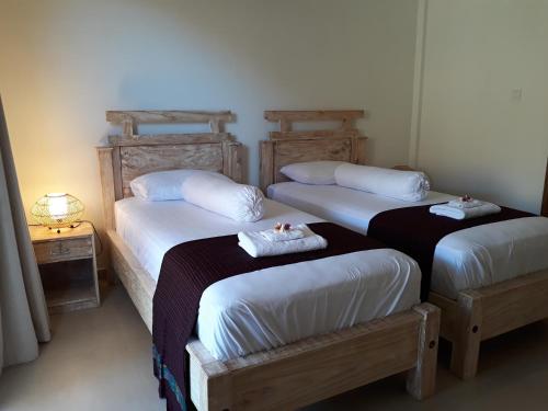 Ένα ή περισσότερα κρεβάτια σε δωμάτιο στο Amed Sudi House