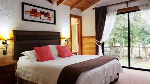 Katil atau katil-katil dalam bilik di Brisas del Lago Pucon