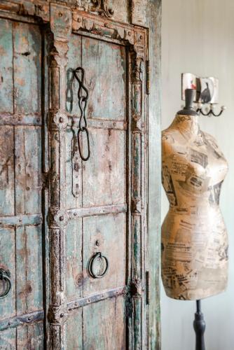 an old wooden door with a mannequin next to a dummy at Relax B&B Lavendine Pure in Genk