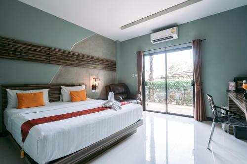 Postel nebo postele na pokoji v ubytování Ray Hotel Buriram